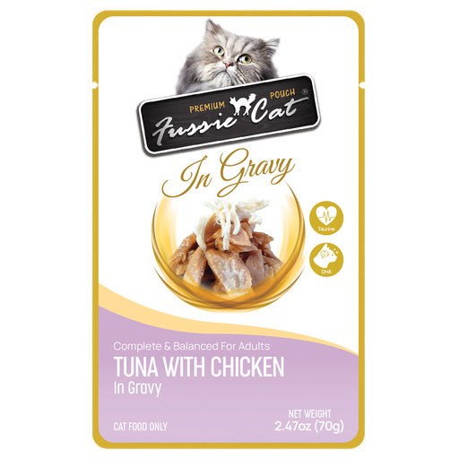 A pouch of Fussie Cat Premium Pouch In Gravy cat food, featuring a gray tabby cat illustration at the top, a bowl of tuna and chicken in gravy, and a lavender and gold design on a white background.