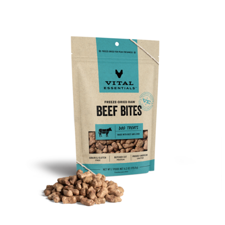 Vital Essentials freeze-dried raw Beef Bites dog treats in a larger pouch with treats displayed in front.