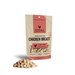 Vital Essentials freeze-dried raw Chicken Breast dog treats in a red-label pouch with treats in front.
