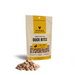 Vital Essentials freeze-dried raw Duck Bites dog treats in a small yellow-label pouch with treats in front.