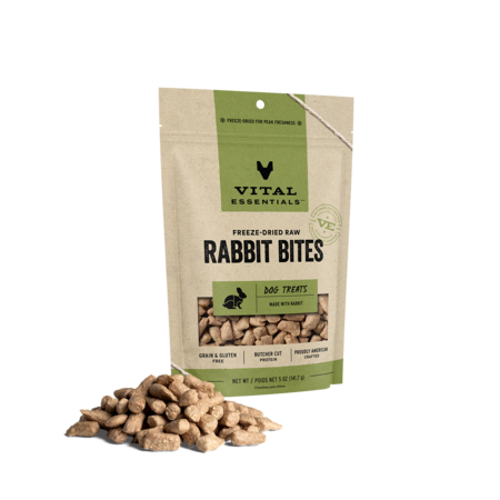 Vital Essentials freeze-dried raw Rabbit Bites dog treats in a larger green-label pouch with treats in front.