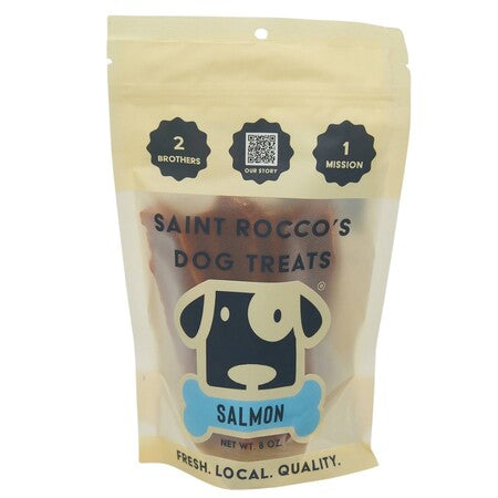 A 6 oz bag of Saint Rocco's Dog Treats Salmon, in a beige resealable stand-up pouch with a cartoon dog logo and black text, shown against a plain white background.