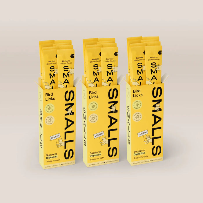 Three yellow boxes of Smalls Bird Licks Chicken Recipe lickable cat treats, with individual treat sticks visible above each box.