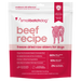 A stand-up pouch of smallbatchdog beef recipe freeze-dried raw sliders for dogs, featuring a white and dark pink design with a pink illustration of a cow and product details.