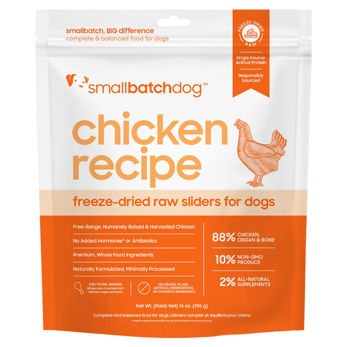 A stand-up pouch of smallbatchdog Chicken Recipe freeze-dried raw sliders for dogs, featuring a white and orange design with a chicken illustration and product details.