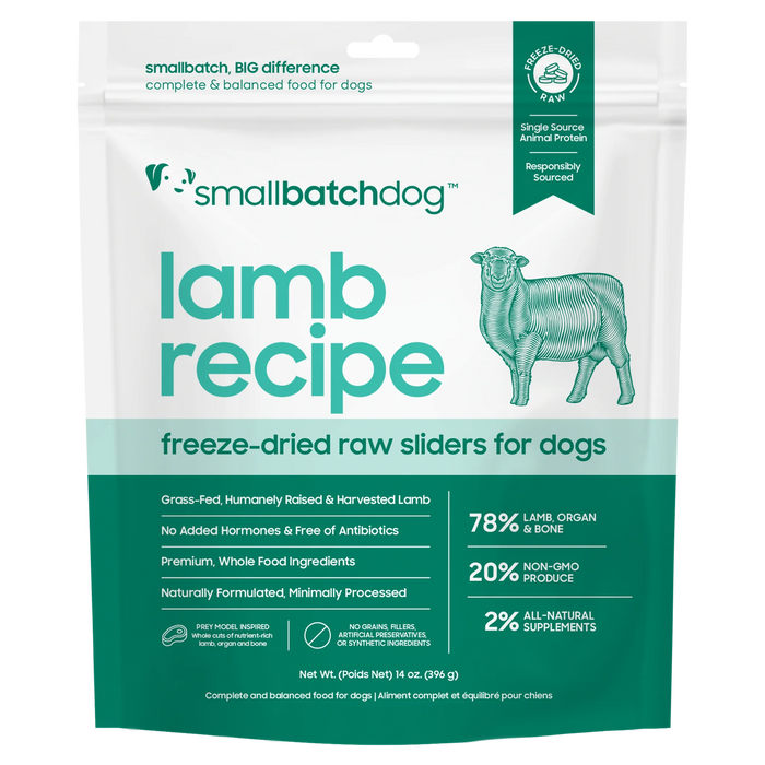 A stand-up pouch of smallbatchdog Lamb Recipe freeze-dried raw sliders for dogs, shown on a plain white background. The package is white with teal and mint green text and graphics, including a line drawing of a lamb and a small green 'Fast Facts' seal.
