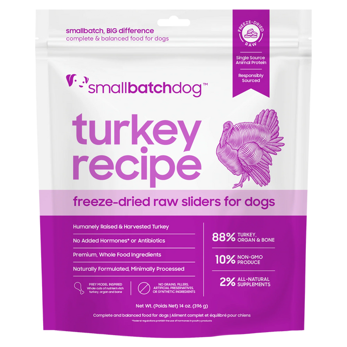A stand-up pouch of Small Batch Dog Turkey Recipe freeze-dried raw sliders for dogs, featuring a white and purple design with a turkey illustration and product details.