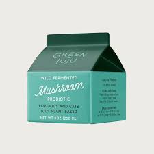 Green carton of mushroom probiotic on a light gray background