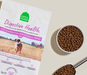 Open Farm digestive health dog food package with a bowl of kibble on a beige surface